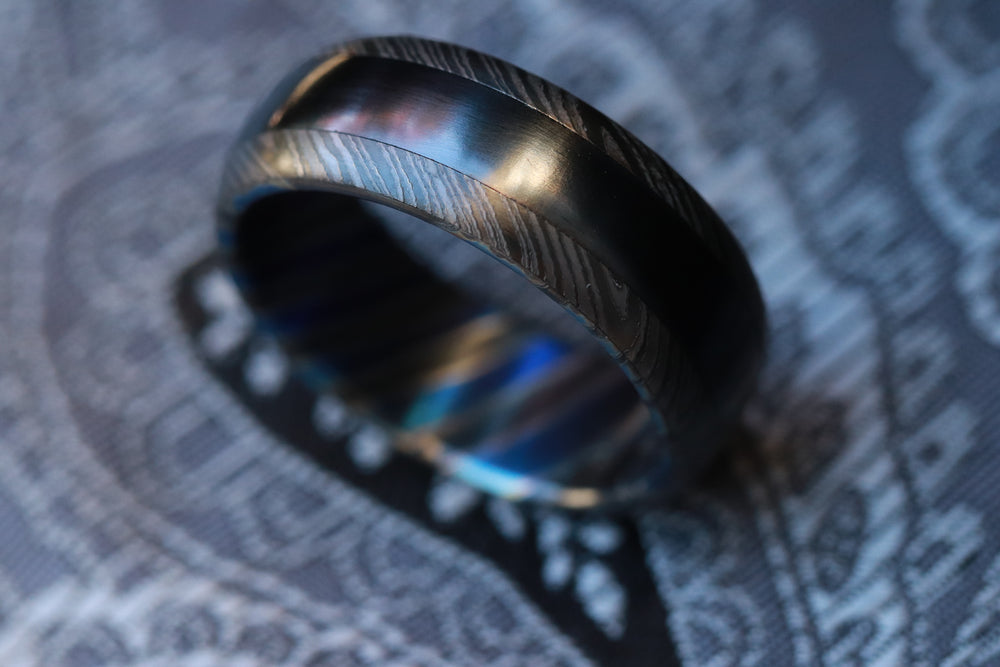 Black titanium and zirconium niobium damscus domed